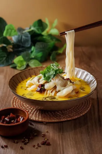 Noodles in Spicy Boiled Fish with Pickled Greens